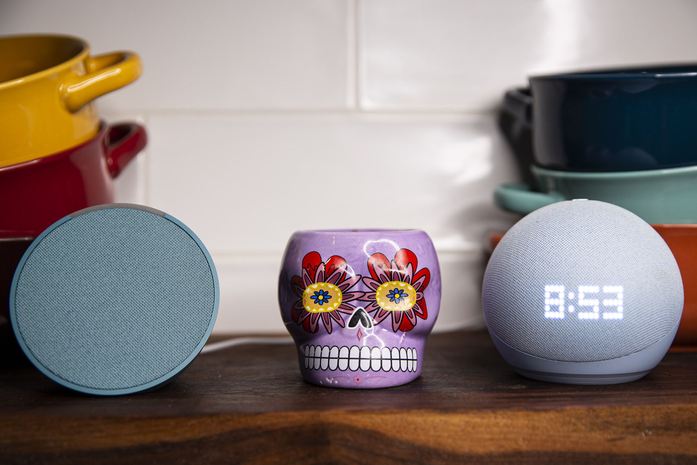 An Amazon Echo Pop (pictured left) and the fifth-generation Echo Dot (right).