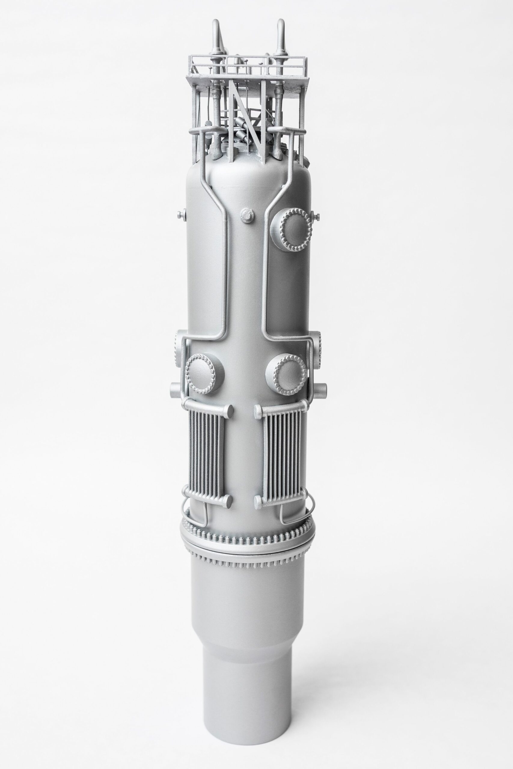 An artist rendering of a cylindrical, metal reactor
